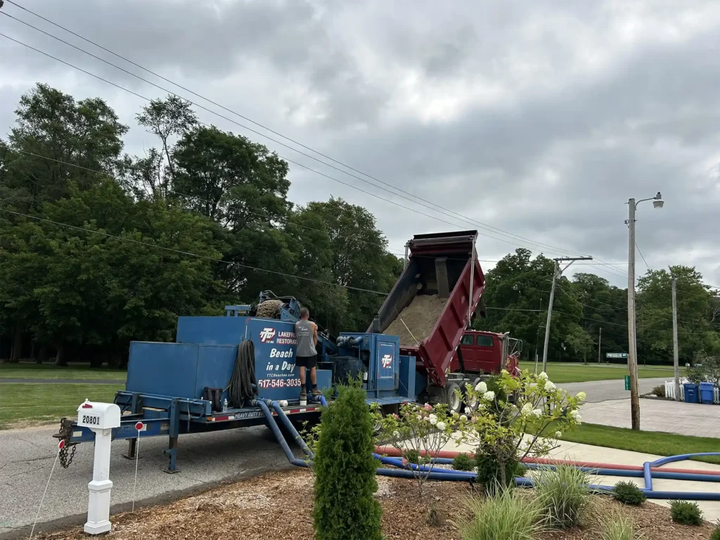 sand pro system on the road side mixing the slurry of stone, sand, and lakewater for the beach restoration on Koontz Lake in Walkerton IN.